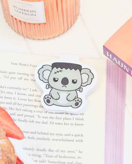 a paper with a cartoon koala on it next to a book