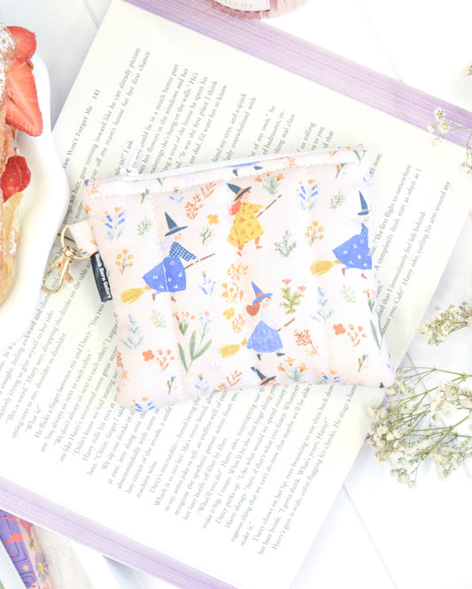 a small purse on top of a book