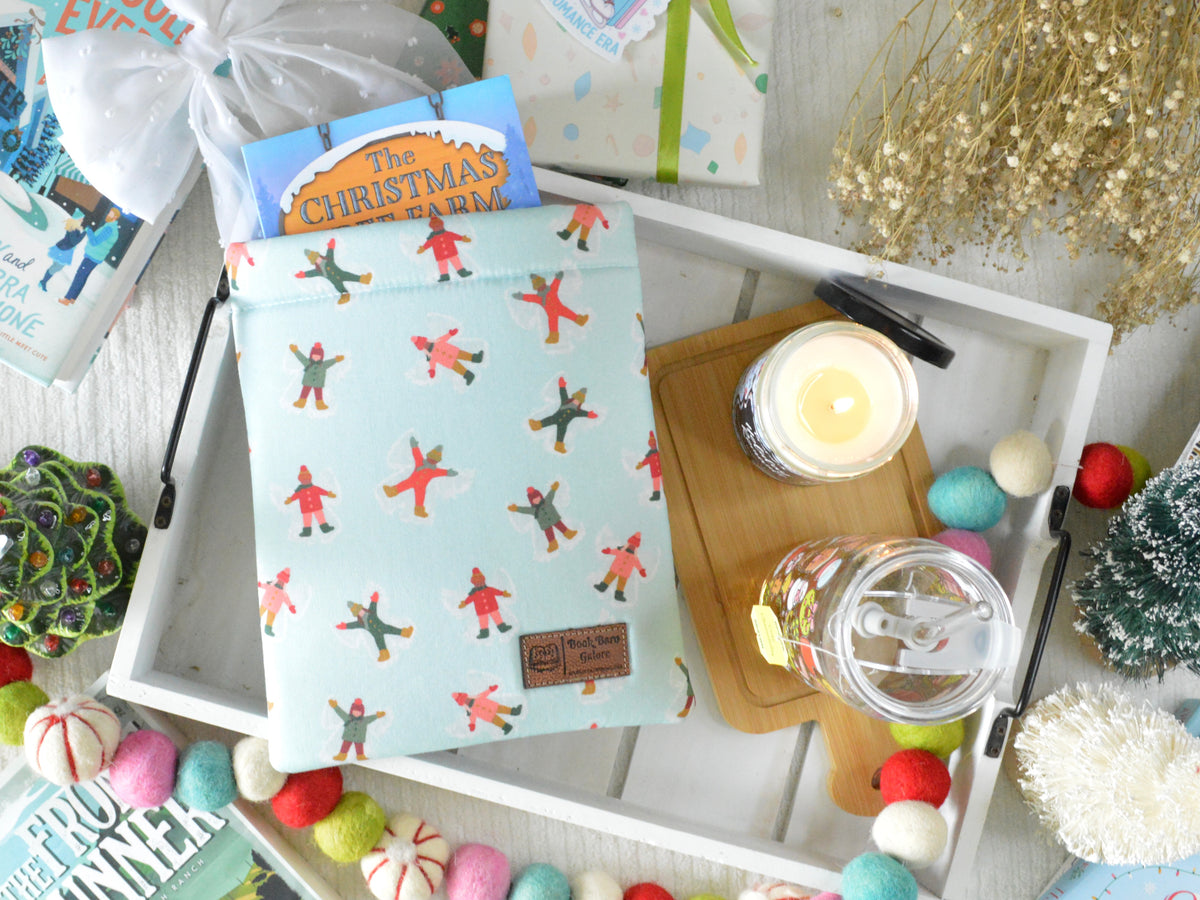 a tray with a book and a candle