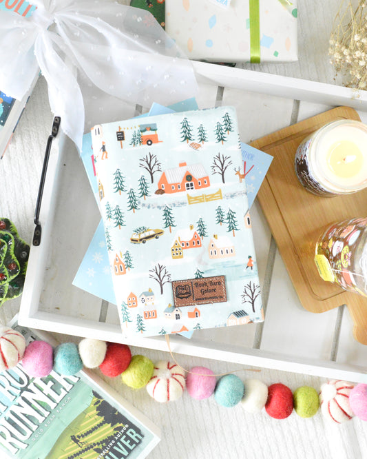 a tray with a book and candles
