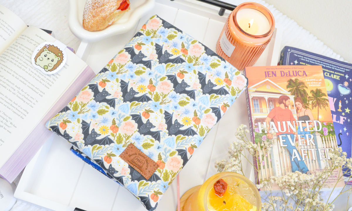 a book and candle on a tray