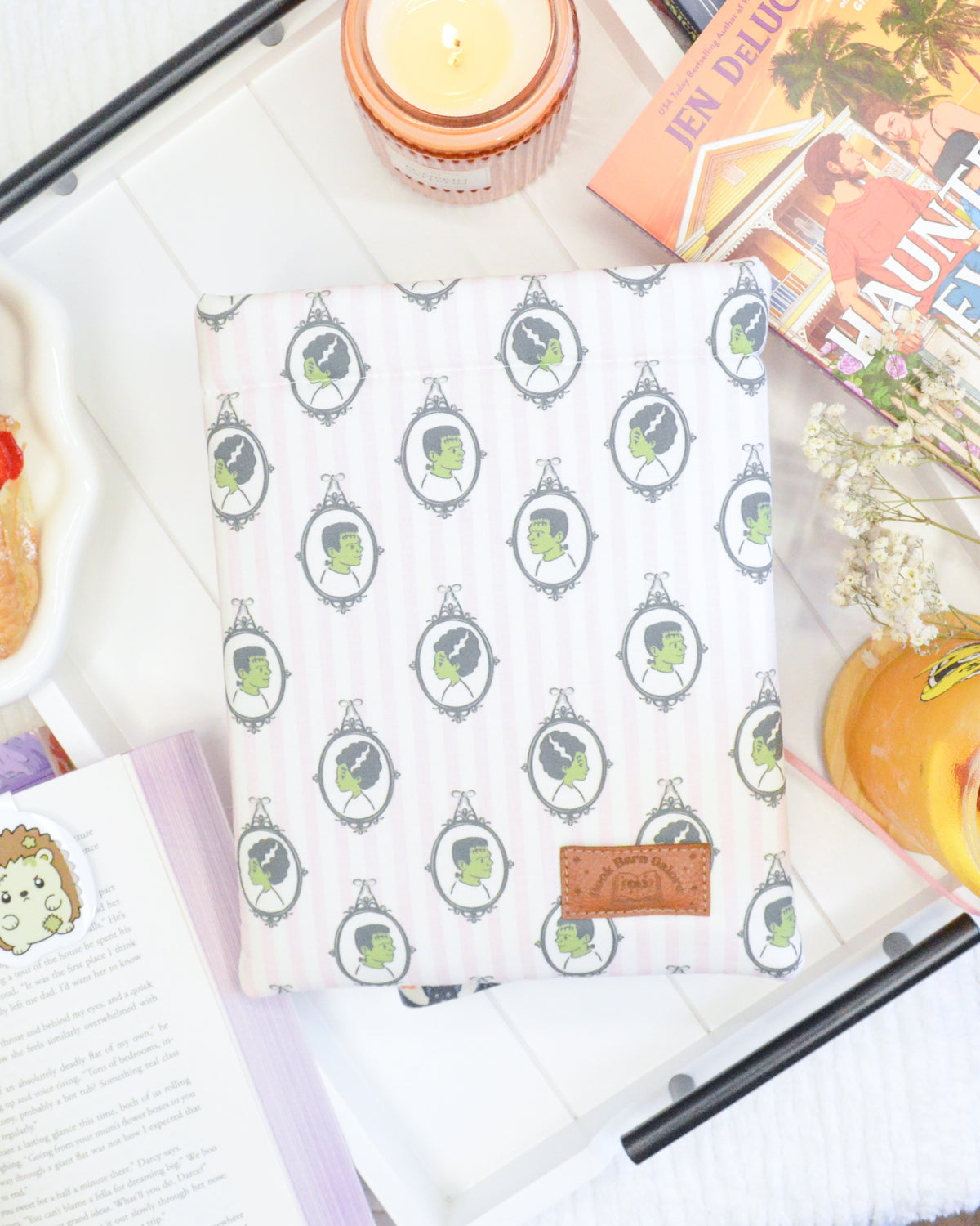 a book and a plate of food on a table